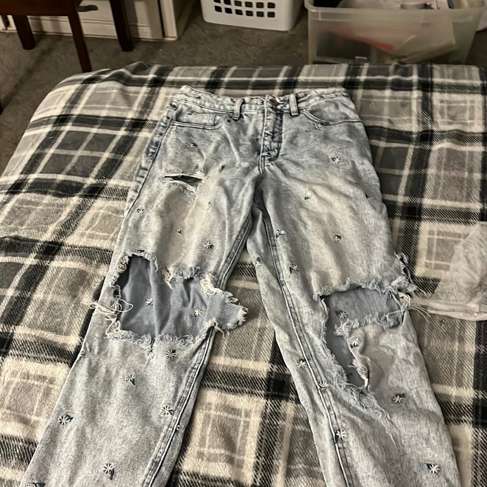 Light blue ripped jeans with flowers